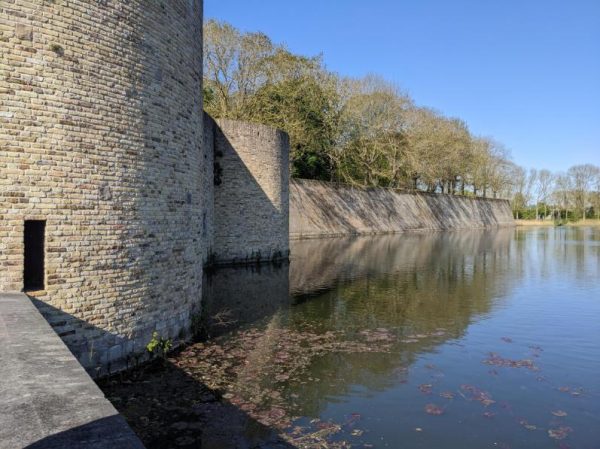 The moat and medieval Fortified city wall (ramparts) around the old city of Ypres (Ieper) Belgium. The Allies used old inner wall tunnels and made more of their own as shelter from Artillery